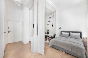 Posteľ alebo postele v izbe v ubytovaní Apartament Kazimierz Mostowa