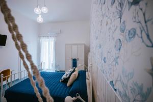 Postel nebo postele na pokoji v ubytování Residenza Delle Sirene