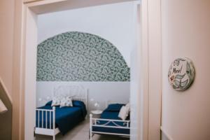 Postel nebo postele na pokoji v ubytování Residenza Delle Sirene