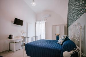 Postel nebo postele na pokoji v ubytování Residenza Delle Sirene