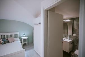 Postel nebo postele na pokoji v ubytování Residenza Delle Sirene