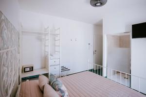 Postel nebo postele na pokoji v ubytování Residenza Delle Sirene