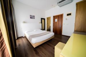 Postel nebo postele na pokoji v ubytování Hotel Trieste