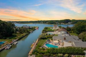 an aerial view of a river with houses and boats at Hamptons Waterfront - Shinnecock Bay in Hampton Bays