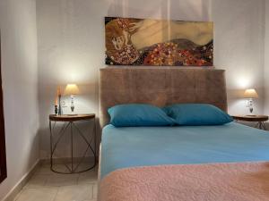 En eller flere senge i et værelse på Sias Cozy House