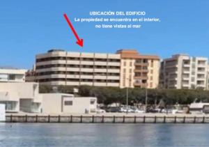 a picture of a building with a red arrow at Paradise of Dreams Apartamentos - MAREA APARTAMENTO in Adra