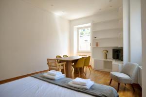 a room with a bed and a table and chairs at Loft 5c - Palatino in Rome