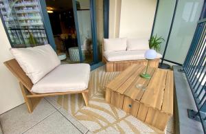 Istumisnurk majutusasutuses Sublime appartement 4 étoiles neuf T3 àPuteaux 61m2 proche La Défense, 10m2 de terrasse avec magnifique vue