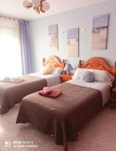 Кровать или кровати в номере kasa kala APARTAMENTO PORTONOVO SANXENXO