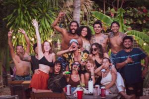 a group of people posing for a picture at Nopalero Hostel in Puerto Escondido