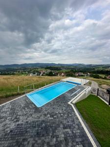 an image of a swimming pool on a house at Dom Na Brzegu in Limanowa