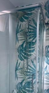 a shower with a blue and white wall at Casa Vacanze Aurelia in Procida