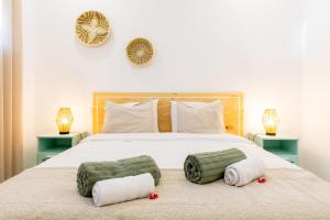 Ένα ή περισσότερα κρεβάτια σε δωμάτιο στο Casa na Areia