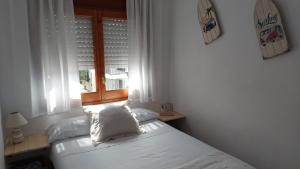 Postel nebo postele na pokoji v ubytování Casa de playa