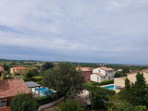 a view of a villa with a swimming pool at Apartments Vilanija in Vilanija
