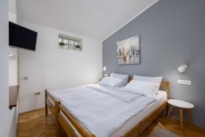 Postel nebo postele na pokoji v ubytování Apartments Tena