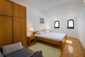 Postel nebo postele na pokoji v ubytování Apartments Tena