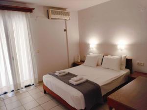 Postel nebo postele na pokoji v ubytování Nancy - Chara Apartments