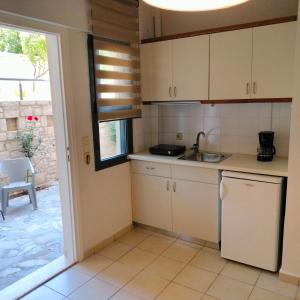 Kuchyň nebo kuchyňský kout v ubytování Nancy - Chara Apartments