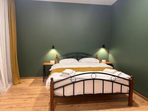 A bed or beds in a room at Hotel Mountime Kazbegi