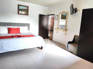 Postel nebo postele na pokoji v ubytování Hotel Jardines Del Carmen