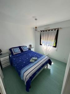 En eller flere senge i et værelse på Côté bassin, maison 4 personnes