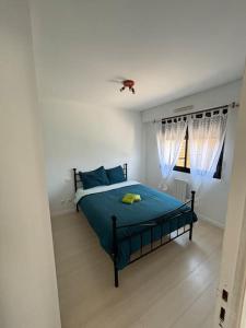 En eller flere senge i et værelse på Côté bassin, maison 4 personnes