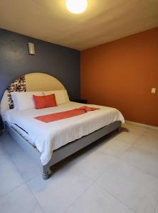 Postel nebo postele na pokoji v ubytování Hotel Jardines Del Carmen