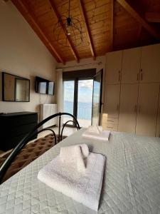 a bedroom with a bed with towels on it at VL Luxury Villa in Kiveri +41 photos