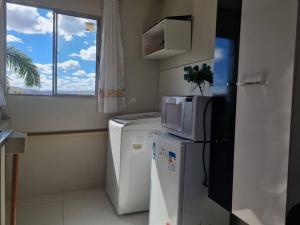 Kuchyň nebo kuchyňský kout v ubytování kitnet 201 central com ar condicionado e tv smart