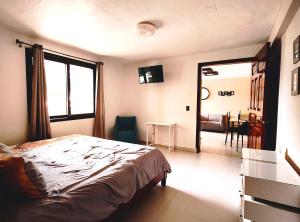 Postel nebo postele na pokoji v ubytování Hotel Jardines Del Carmen