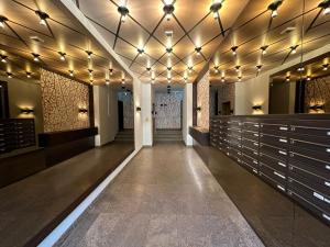 a hallway with lights on the ceiling of a building at EITHER Private 2B2B OR Shared 1B1B, Luxury, Bright, Spacious in Berlin