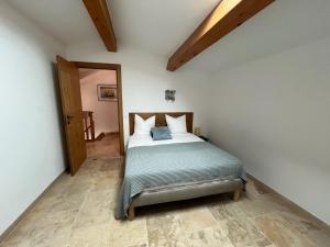 Postel nebo postele na pokoji v ubytování Les Villas du Parc + 25 fotografií