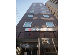 a tall building with an eel hotel sign on it at ELE HOTEL Higashi Ueno - Vacation STAY 08002v in Tokyo