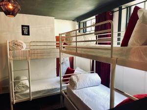 a room with three bunk beds in a hostel at Big Group Stays in Brighton & Hove