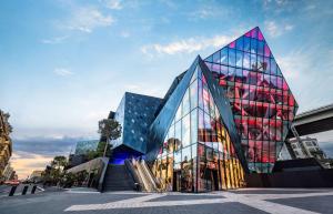 a large glass building with a staircase in front of it at Doubletree By Hilton Nice Centre Iconic in Nice