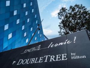 a sign in front of a building at Doubletree By Hilton Nice Centre Iconic in Nice