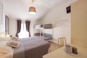 Postel nebo postele na pokoji v ubytování Hotel Il Nido