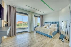 a bedroom with a bed and a large window at Villa NIKSUN in Bibinje +36 photos
