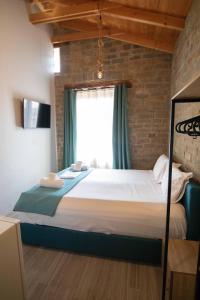 Posteľ alebo postele v izbe v ubytovaní Agora Boutique Apartments Ioannina