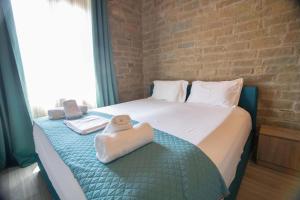 Posteľ alebo postele v izbe v ubytovaní Agora Boutique Apartments Ioannina