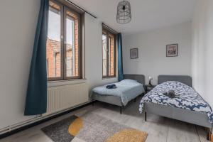 Postel nebo postele na pokoji v ubytování Douai house