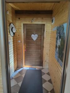 a sauna with a door with a heart on it at Durmitorski cvijet in Žabljak
