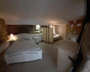 A bed or beds in a room at Hostal Casa Martinez