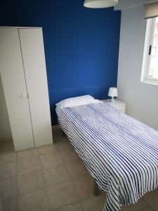 Łóżko lub łóżka w pokoju w obiekcie Apartamento marinero