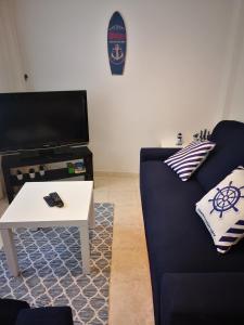 Telewizja i/lub zestaw kina domowego w obiekcie Apartamento marinero