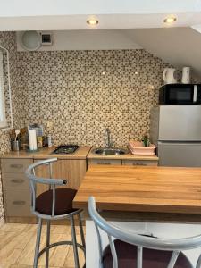 Kuchyňa alebo kuchynka v ubytovaní Studio Apartments MT