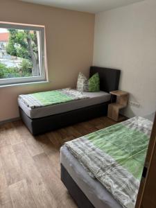Postel nebo postele na pokoji v ubytování Ferienwohnung Zeitler