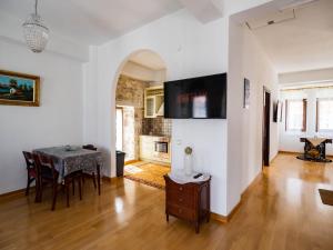 a kitchen and dining room with a table and chairs at Mansion 1887 in Limenas