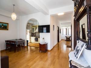 a living room with a table and a dining room at Mansion 1887 in Limenas